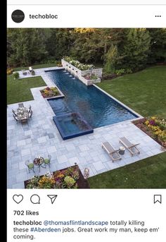 an aerial view of a swimming pool surrounded by lawn furniture and flowers in the backyard