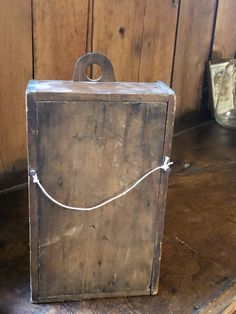 an old wooden box sitting on top of a table