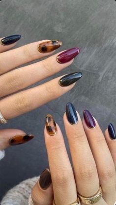 Get inspired with gorgeous fall nail designs that are perfect for both fall and winter seasons. Try these cozy colors and trendy patterns! #fallnails #winternaildesigns #fallnailtrends #winternails2024 Dark Plum Nails Designs, Wizard Nails, Fall Oval Nails, French Manicure Long Nails, Jewel Tone Nails, Dark Nails, Oval Nails