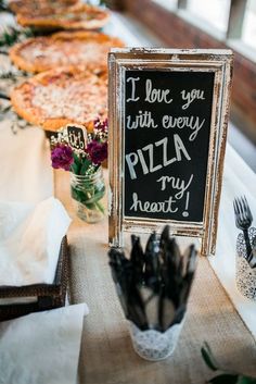 there is a sign that says i love you with every pizza try my heart out