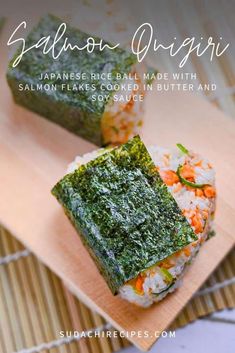 two sushi rolls on a wooden plate with green sauce