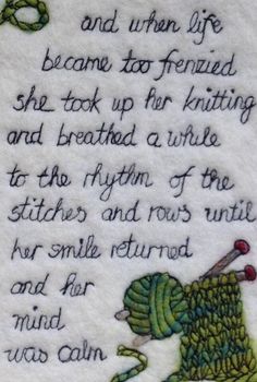 a piece of embroidered fabric with words written in cursive writing on the bottom