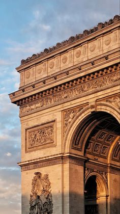 the sun is shining on an ornate arch