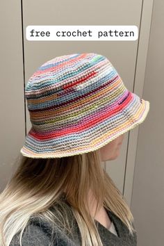 a woman wearing a multicolored hat with the text free crochet pattern