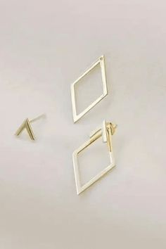 Our dual wear earrings feature a sleek, modern design with geometric influences. Can be worn together or separately! One pair showcases a minimalist diamond shape, while the other includes an understated triangular stud. The clean lines and open design of the diamond-shaped earrings provide a contemporary feel, allowing them to pair elegantly with both casual and formal outfits. Post style backing Approx. 1" x 1/2" Formal Outfits, Geometric Jewelry, Open Design, Diamond Shaped, Geometric Earrings, Formal Outfit, Diamond Shape, Diamond Shapes, Clean Lines