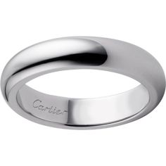 a white gold wedding ring with the word carrier engraved on it