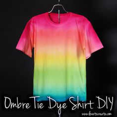 a rainbow colored t - shirt hanging on a hanger with the words, ombre tie dye shirt diy