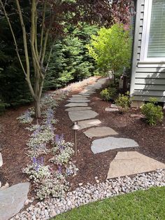 a stone path in front of a house