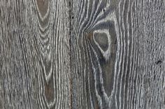 an image of wood textured with knots and holes in the boards or planks