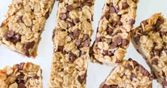 chocolate chip granola bars cut into squares and stacked on top of each other, ready to be eaten