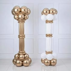 two gold and white vases with balloons on them