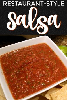 salsa in a white bowl with tortilla chips on the side