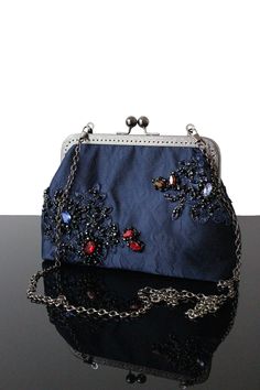 Our collection of Vintage beaded purse and Evening Navy blue beaded purse made in France.  Luxury French lace fabric and Kiss lock frame. Wedding clutch bag. The evening bags are a unique piece of the Olga's Luxury Creation. Crystal embellished bag. This Navy blue beaded purse will sublimate you during your galas, parties, Wedding and events.  Elegance, style and originality are the key parts of these creations. The use of quality materials, advanced know-how are essential values to offer you th Blue Clutch Evening Bag For Wedding, Blue Embellished Evening Bag For Formal Occasions, Elegant Blue Clutch Ideal As A Gift, Handmade Blue Evening Bag For Formal Occasions, Handmade Blue Clutch For Formal Events, Handmade Blue Clutch For Formal Occasions, Blue Beaded Evening Bag For Formal Occasions, Blue Handmade Evening Bag For Wedding, Blue Pouch Evening Bag For Events