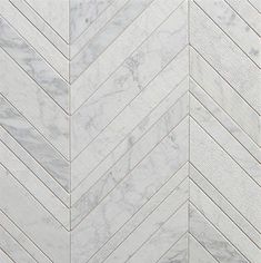 a white marble herringle tile pattern