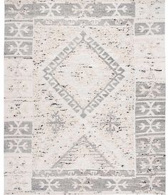 a gray and white rug with an abstract design on the bottom, in front of a white background