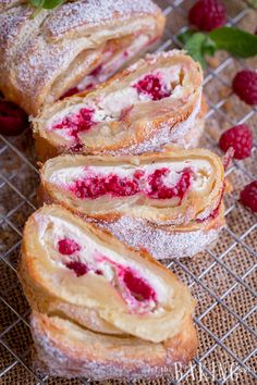 raspberry roll with powdered sugar and fresh raspberries on the side