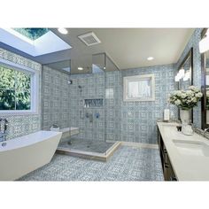 a bathroom with blue and white tiles on the walls, shower stall, sink, and bathtub