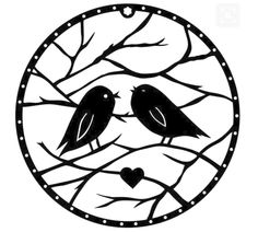 two birds sitting on top of a tree branch next to a heart shaped window sill