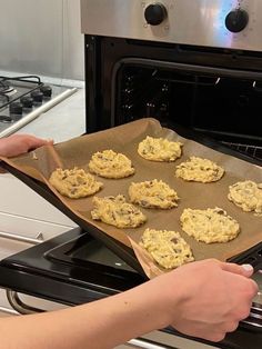 someone is baking cookies in an oven