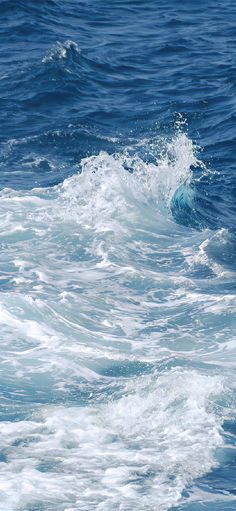 a person riding a surfboard in the ocean