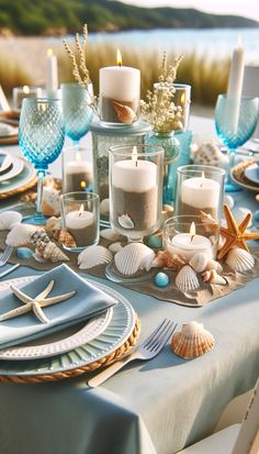 the table is set with candles and seashells