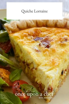 a quiche is shown on a plate with salad