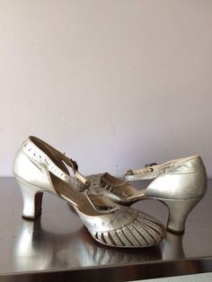 "Wonderful pair of late 20's-early 30's strapping- sandal style shoe. Costume or movie stock accessory. In fair vintage condition, some wear but not the type of shoe where you want to cram your foot into, as the sandal type of straps in the front of the shoe will not take the stress. For the collector of Deco shoes. There is no size listed in this shoe, I believe they were custom made for someone. You would need to have a small narrow foot to wear these shoes comfortably with out causing any dre Shoe Costume, Vintage Shoes Women, Character Wardrobe, Sandal Style, Womens Mary Janes, Metallic Shoes, Old Shoes, Shoe Fits, Court Shoes