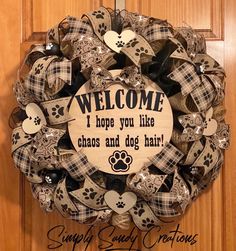 a welcome sign is hanging on the front door for someone's dog lovers to welcome