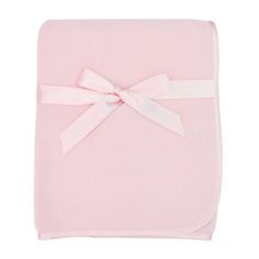 a pink blanket with a white bow on the front and back of it's cover