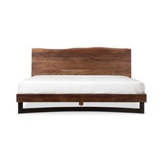 the bed frame is made from wood and has white sheets