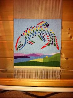 a weaving project with an image of a fish on it