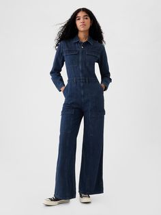 Authentic, no-stretch denim jumpsuit.  Point collar, button front.  Long sleeves.  Patch pockets at chest.  Elasticized waist.  Front slant pocket, back patch pockets.  Cargo pockets at sides.  Responsibly Made: This denim jumpsuit is made with 5% recycled cotton and is part of our water-saving Washwell program.  Compared with conventional wash methods, Washwell uses at least 20% less water and has saved over a billion liters of water since 2016.  Fit: Slim.  A fitted silhouette that fits close to the body.  Full-length, wide leg.  Models wearing Gap Jumpsuit Long Sleeve, Cargo Jumpsuit, Denim Suit, Vibe Check, Denim Cargo, Fig Leaves, Jumpsuit Outfit, Water Saving, Gap Denim