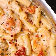 pasta with shrimp and tomato sauce in a pan