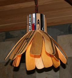 a wooden light fixture hanging from a ceiling