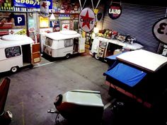 a garage filled with lots of different types of vehicles