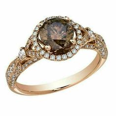 a brown diamond ring with diamonds around it