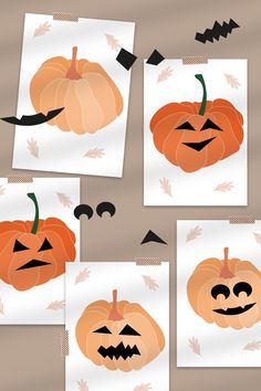 four pumpkins cut out from paper with different shapes and sizes to make them look like jack - o'- lanterns