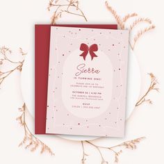 a pink and red birthday card with a bow on it