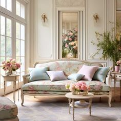 a living room filled with furniture and flowers