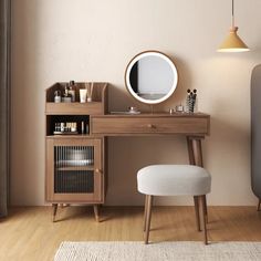 a wooden desk with a mirror, stool and other items on it in a room