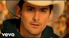 a man wearing a cowboy hat and looking at the camera