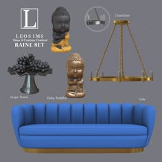 a blue couch sitting under a chandelier next to a table with buddha figurines on it