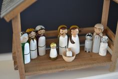 a nativity scene with figurines on a shelf