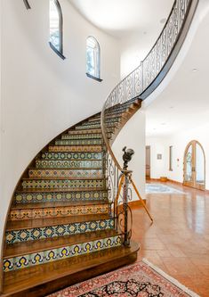 a spiral staircase in the middle of a house