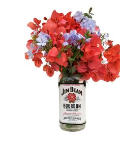 a jar filled with red, white and blue flowers