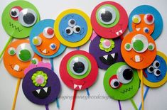 colorful paper flowers with googly eyes on them