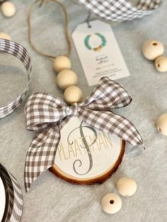 a table topped with wooden beads and ribbon