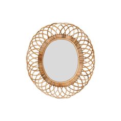 a round mirror sitting on top of a white wall