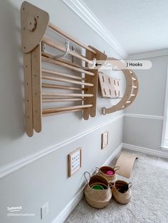 a pair of shoes sitting on the floor next to a wall rack