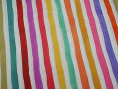 multicolored striped fabric with white background